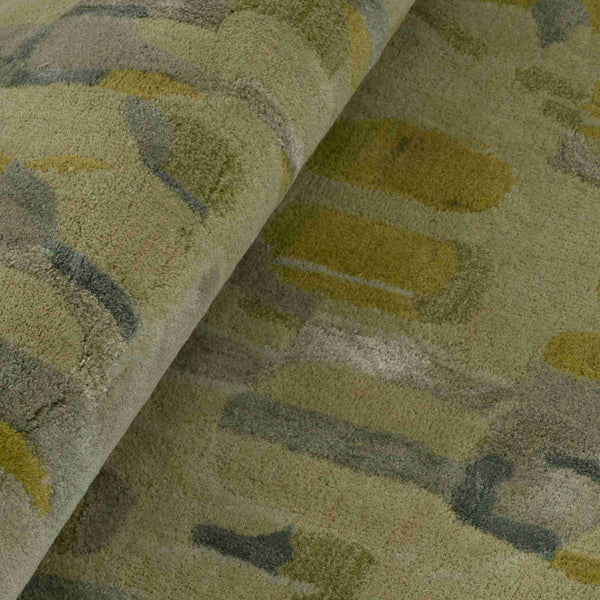 Nabi Green — zbliżenie tkaniny, splot wełny z abstrakcyjnym deseniem